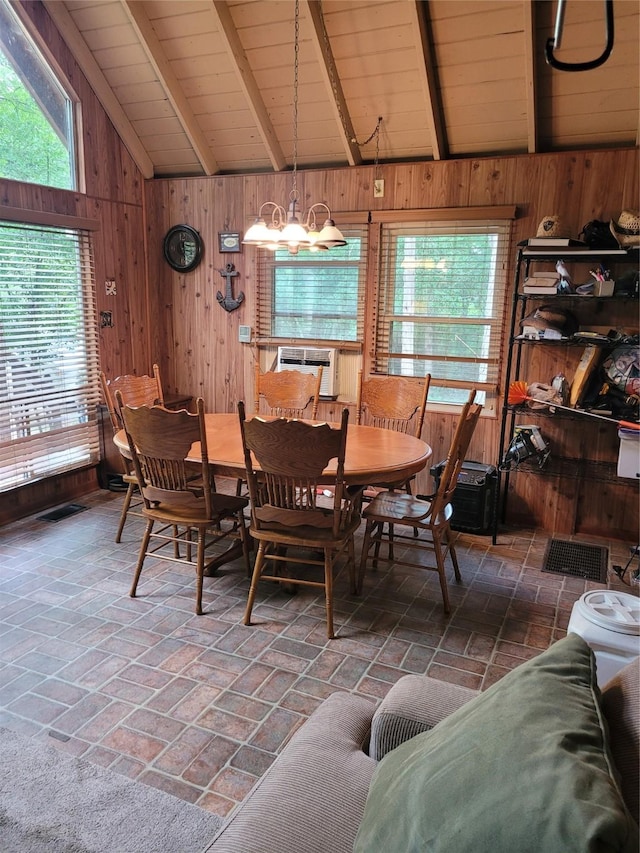 20 Shannon St, Huntsville, TX 77320 - dining area featuring wooden walls, brick patterned flooring, wooden ceiling, and a chandelier