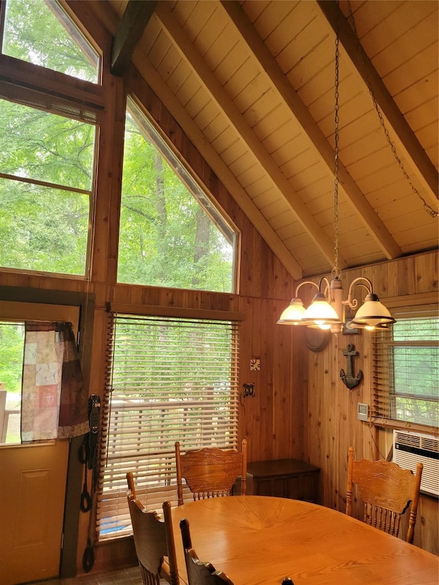 20 Shannon St, Huntsville, TX 77320 - dining area with a chandelier, wood walls, and wooden ceiling