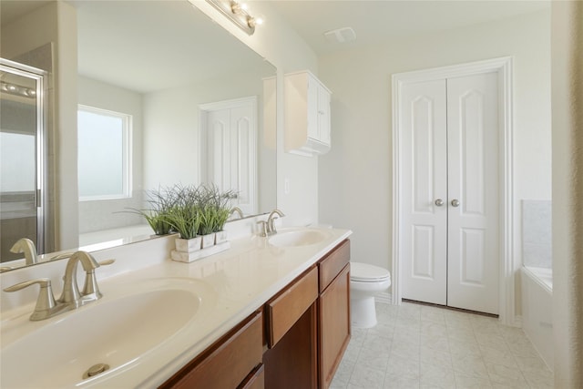 2806 Old Draw Dr, Humble, TX 77396 - bathroom featuring double vanity, a stall shower, a bath, and toilet