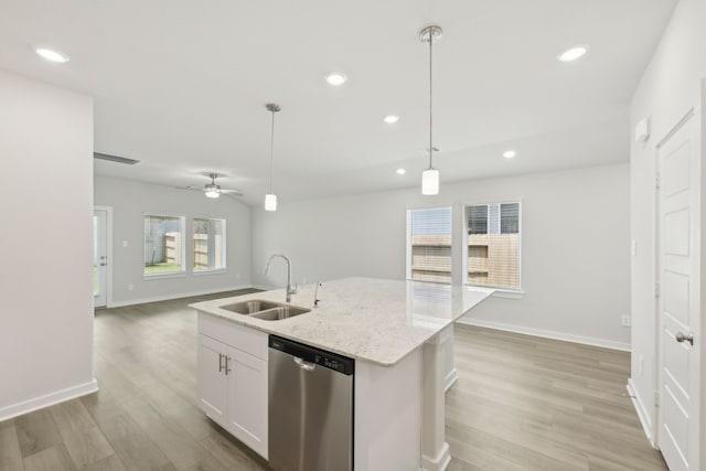 kitchen featuring a sink, stainless steel dishwasher, recessed lighting, light wood finished floors, and pendant lighting