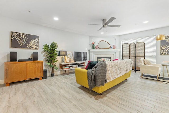 8051 Bay Branch Dr Unit 324, The Woodlands, TX 77382 - living area featuring ceiling fan, light wood-type flooring, recessed lighting, baseboards, and a tile fireplace