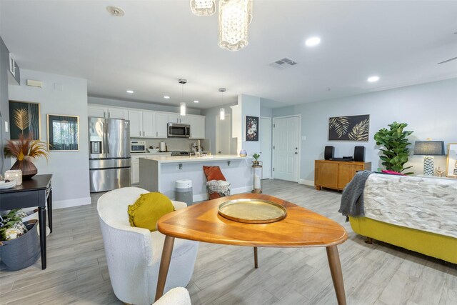 8051 Bay Branch Dr Unit 324, The Woodlands, TX 77382 - dining room featuring baseboards, light wood-style flooring, and recessed lighting
