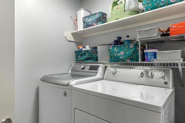 8051 Bay Branch Dr Unit 324, The Woodlands, TX 77382 - clothes washing area featuring washing machine and dryer