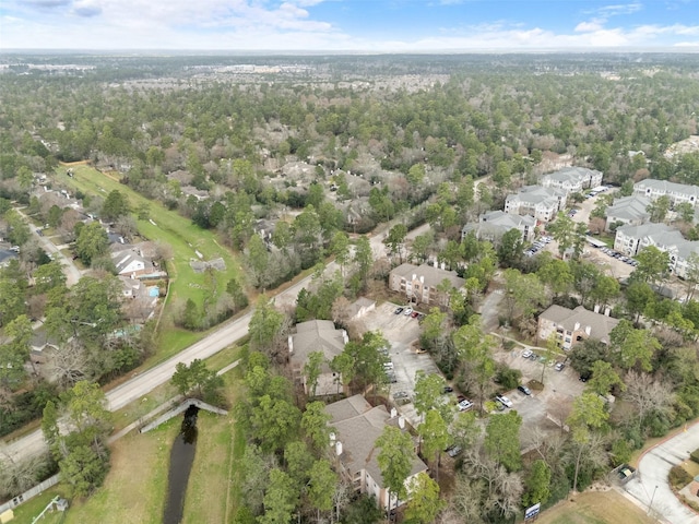8051 Bay Branch Dr Unit 324, The Woodlands, TX 77382 - aerial view of property's location with nearby suburban area and a forest