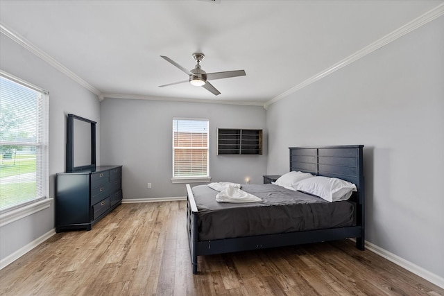 3003 Randall St, Houston, TX 77018 - bedroom with multiple windows, crown molding, light wood-style flooring, and baseboards