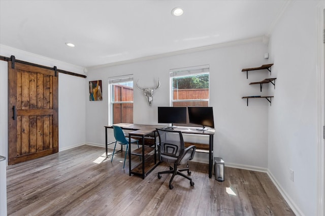 3003 Randall St, Houston, TX 77018 - office area featuring crown molding, a barn door, wood finished floors, baseboards, and recessed lighting