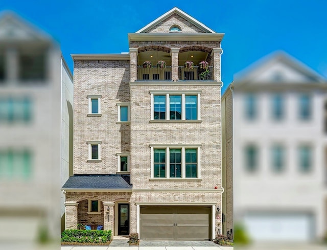 3604 Dorset Cliff Ln, Houston, TX 77055 - view of front of house with a balcony, brick siding, driveway, and an attached garage