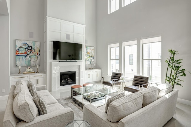 3604 Dorset Cliff Ln, Houston, TX 77055 - living area with a towering ceiling, baseboards, and a fireplace