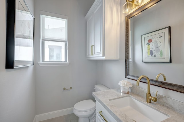 3604 Dorset Cliff Ln, Houston, TX 77055 - bathroom with healthy amount of natural light, toilet, vanity, and baseboards
