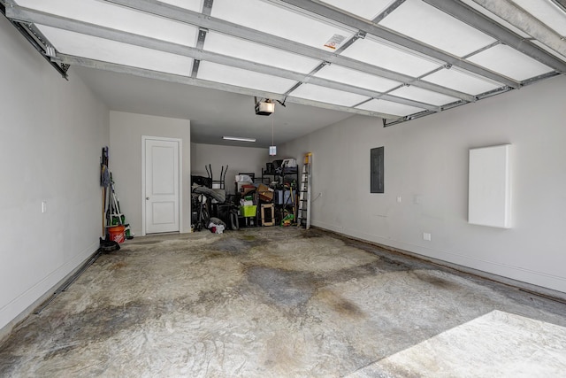 3604 Dorset Cliff Ln, Houston, TX 77055 - garage featuring a garage door opener, electric panel, and baseboards