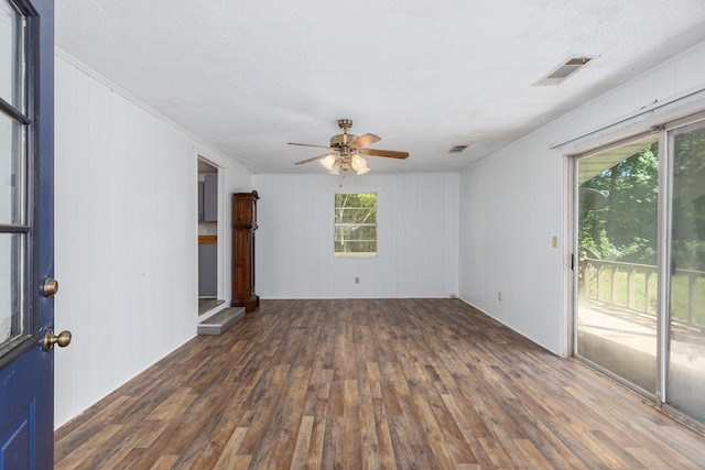 126 Cris Rd, Lufkin, TX 75901 - spare room featuring wood finished floors, a ceiling fan, ornamental molding, and a textured ceiling