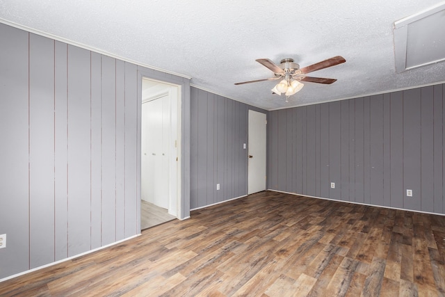 126 Cris Rd, Lufkin, TX 75901 - spare room with wood finished floors, a ceiling fan, a textured ceiling, and ornamental molding
