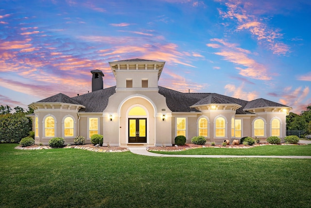 2119 Red Bird Ln, Brookshire, TX 77423 - mediterranean / spanish-style home featuring french doors, stucco siding, a yard, a chimney, and a shingled roof