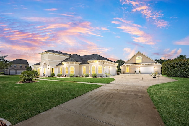 2119 Red Bird Ln, Brookshire, TX 77423 - view of front facade featuring concrete driveway, a yard, and stucco siding