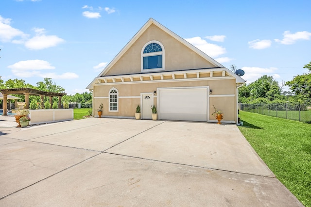 2119 Red Bird Ln, Brookshire, TX 77423 - view of front of home with stucco siding, concrete driveway, and a pergola