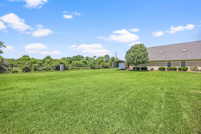 2119 Red Bird Ln, Brookshire, TX 77423 - view of green lawn featuring a detached carport