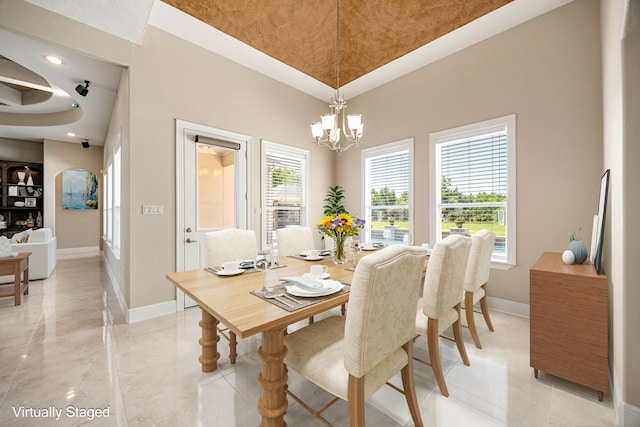 2119 Red Bird Ln, Brookshire, TX 77423 - dining space with baseboards, a chandelier, a towering ceiling, and recessed lighting