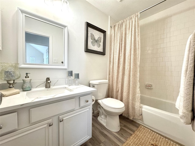 9630 E Withers Way Cir, Houston, TX 77065 - full bath featuring wood finished floors, toilet, vanity, shower / tub combo, and a textured ceiling