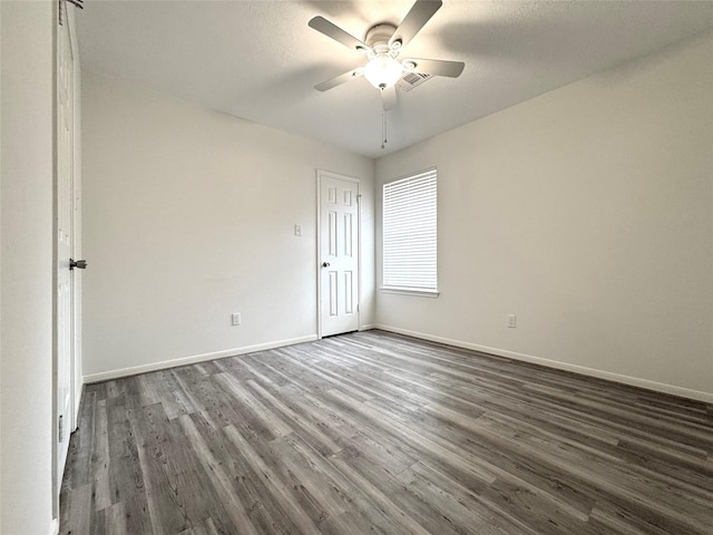 9630 E Withers Way Cir, Houston, TX 77065 - spare room with dark wood finished floors, baseboards, and ceiling fan