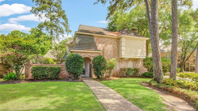5410 Coral Ridge Rd, Houston, TX 77069 - view of front facade with brick siding and a front lawn