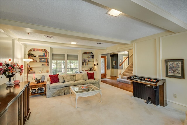5410 Coral Ridge Rd, Houston, TX 77069 - living area with a textured ceiling, stairway, carpet, and crown molding