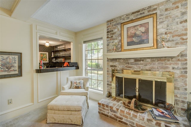 5410 Coral Ridge Rd, Houston, TX 77069 - living area with a fireplace, a textured ceiling, and carpet floors