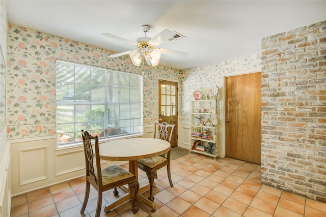 5410 Coral Ridge Rd, Houston, TX 77069 - dining area featuring wallpapered walls, wainscoting, a ceiling fan, and light tile patterned floors