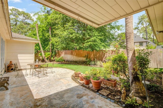 5410 Coral Ridge Rd, Houston, TX 77069 - view of patio with a fenced backyard and outdoor dining space
