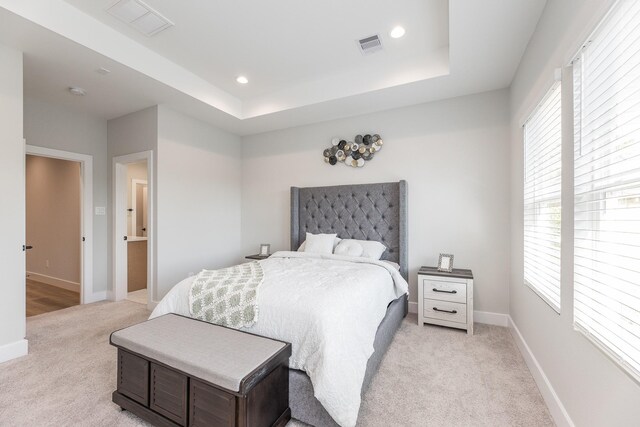 3312 Bremond St, Houston, TX 77004 - bedroom featuring light carpet, baseboards, recessed lighting, and a tray ceiling