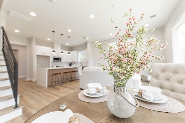 3312 Bremond St, Houston, TX 77004 - dining space with stairway, recessed lighting, and light wood finished floors