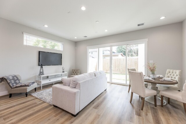 3312 Bremond St, Houston, TX 77004 - living area featuring plenty of natural light, light wood finished floors, and recessed lighting