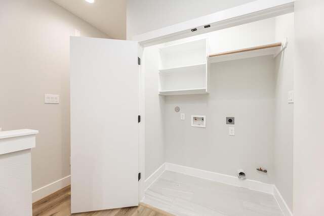 3312 Bremond St, Houston, TX 77004 - washroom featuring hookup for a gas dryer, washer hookup, electric dryer hookup, baseboards, and light wood-style flooring