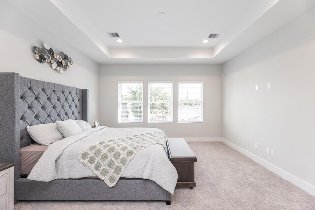 3312 Bremond St, Houston, TX 77004 - bedroom with baseboards, light carpet, a tray ceiling, and recessed lighting