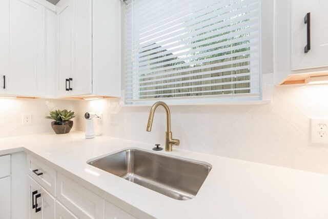 3312 Bremond St, Houston, TX 77004 - kitchen with a sink, white cabinets, and light countertops