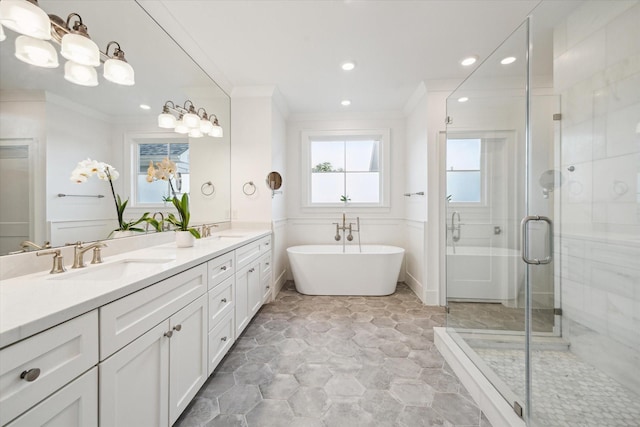 712 E 14th St, Houston, TX 77008 - bathroom with crown molding, a freestanding bath, double vanity, a stall shower, and recessed lighting