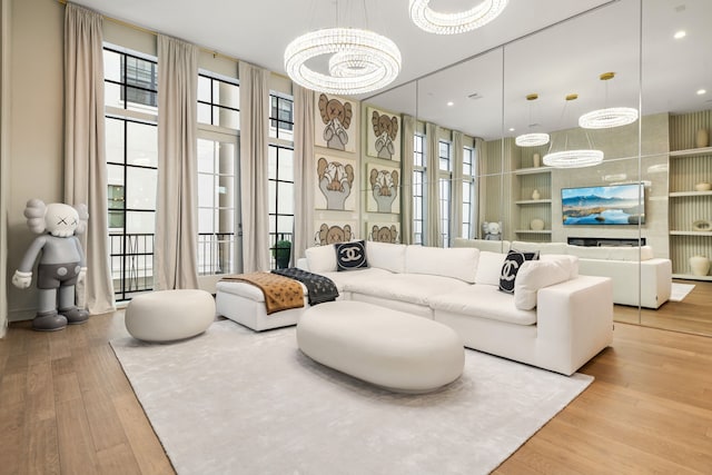 5820 Winsome Ln Unit B, Houston, TX 77057 - living area with light wood finished floors, a chandelier, and built in features