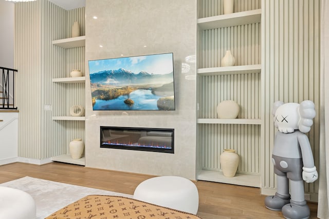 5820 Winsome Ln Unit B, Houston, TX 77057 - living area with wood finished floors, a glass covered fireplace, and baseboards