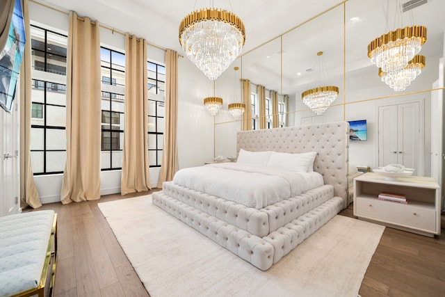 5820 Winsome Ln Unit B, Houston, TX 77057 - bedroom featuring a chandelier, wood-type flooring, and recessed lighting