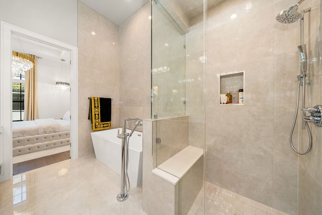 5820 Winsome Ln Unit B, Houston, TX 77057 - bathroom featuring tiled shower, a freestanding tub, and ensuite bathroom
