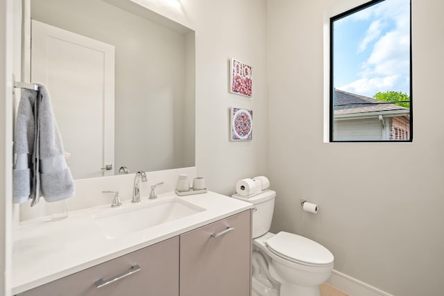 5820 Winsome Ln Unit B, Houston, TX 77057 - bathroom with toilet, vanity, and baseboards