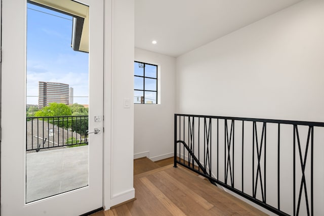 5820 Winsome Ln Unit B, Houston, TX 77057 - doorway to outside featuring wood finished floors, baseboards, and recessed lighting