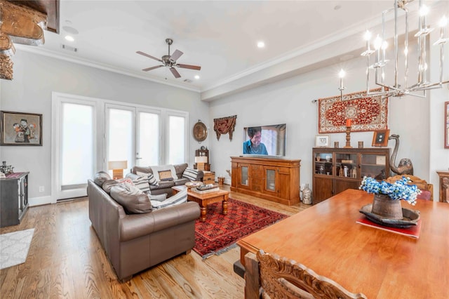 2110 Mason St, Houston, TX 77006 - living room featuring crown molding, wood finished floors, a ceiling fan, a chandelier, and recessed lighting