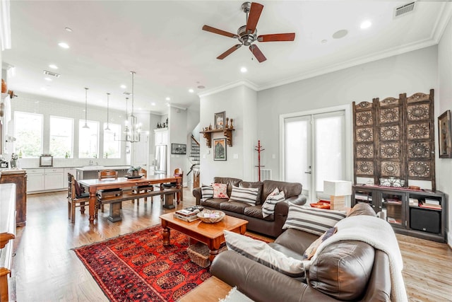 2110 Mason St, Houston, TX 77006 - living area with plenty of natural light, a ceiling fan, light wood-style flooring, recessed lighting, and ornamental molding