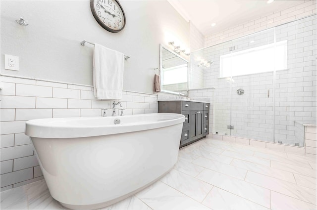 2110 Mason St, Houston, TX 77006 - bathroom featuring tile walls, a stall shower, vanity, and a freestanding bath