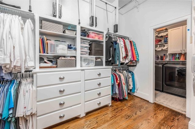 2110 Mason St, Houston, TX 77006 - spacious closet featuring washer and dryer and light wood-style floors