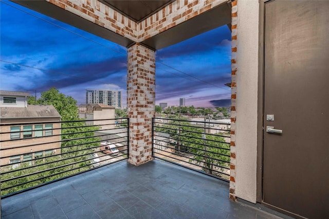 2110 Mason St, Houston, TX 77006 - balcony at dusk featuring a view of city