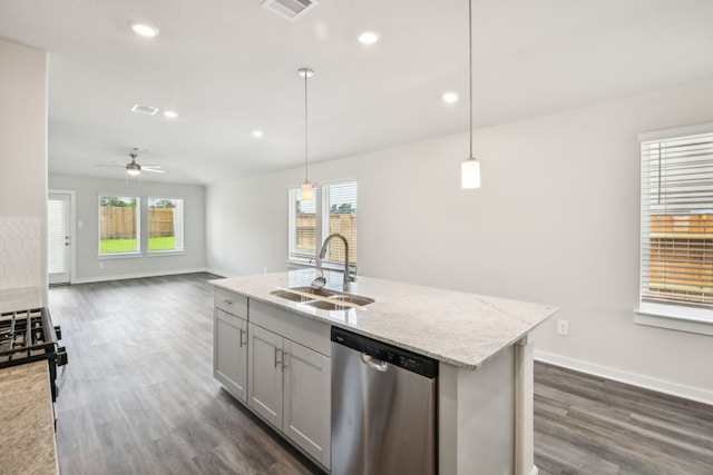 18717 Bliss Pl, New Caney, TX 77357 - kitchen with stainless steel dishwasher, a sink, dark wood finished floors, baseboards, and recessed lighting