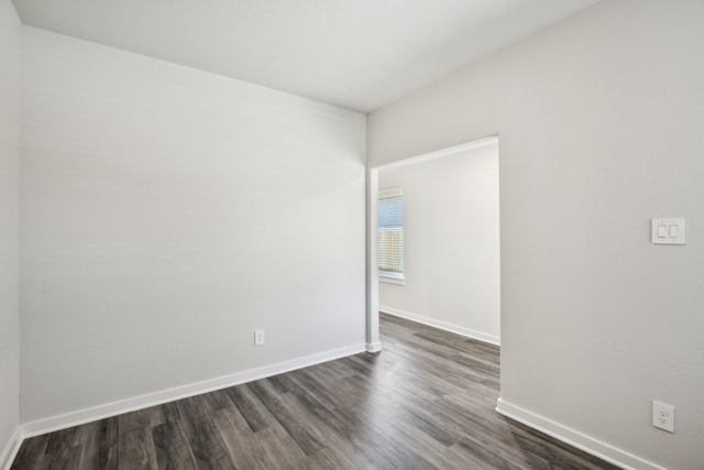 18717 Bliss Pl, New Caney, TX 77357 - unfurnished room with dark wood-style flooring and baseboards