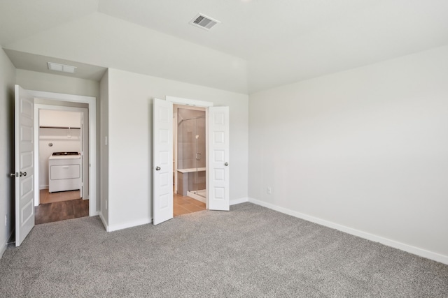18717 Bliss Pl, New Caney, TX 77357 - unfurnished bedroom featuring washer / dryer, carpet flooring, baseboards, and connected bathroom