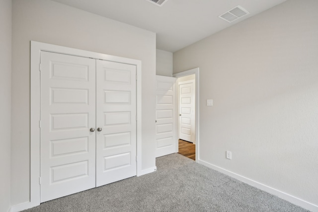 18717 Bliss Pl, New Caney, TX 77357 - unfurnished bedroom with carpet floors, baseboards, and a closet